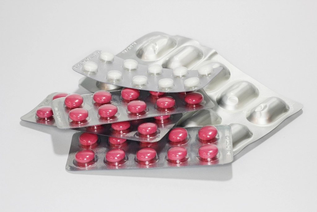 Strips of red and white tablets in foil blister packs
