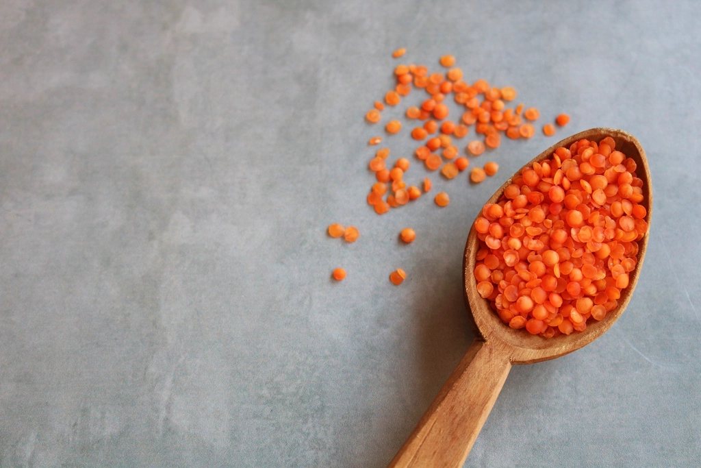 Wooden spoon of red lentils, a Canadian-grown staple
