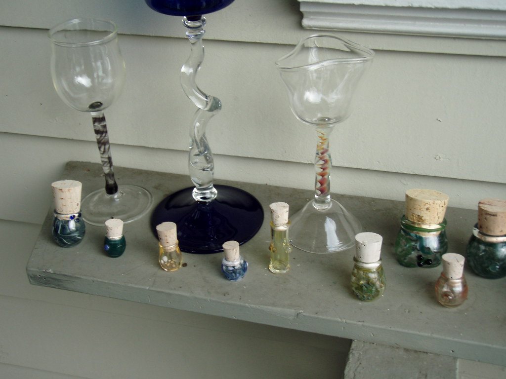 Row of small glass vials on a shelf