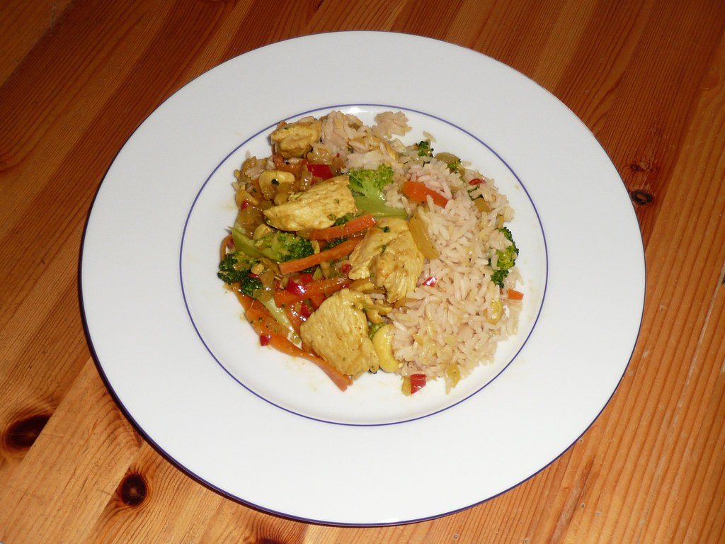 Plate of chicken with rice and vegetables