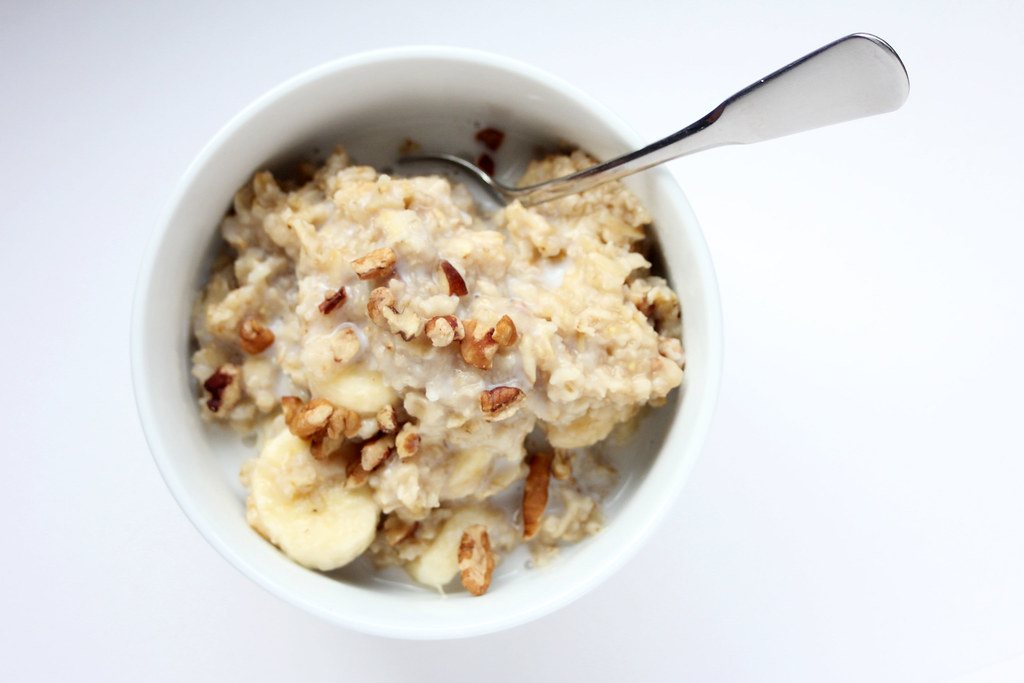 Bowl of oatmeal topped with banana slices