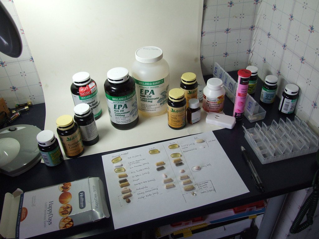 Supplement bottles and capsules on a table