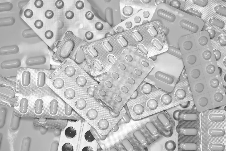 Black and white close-up of tablets in blister packs