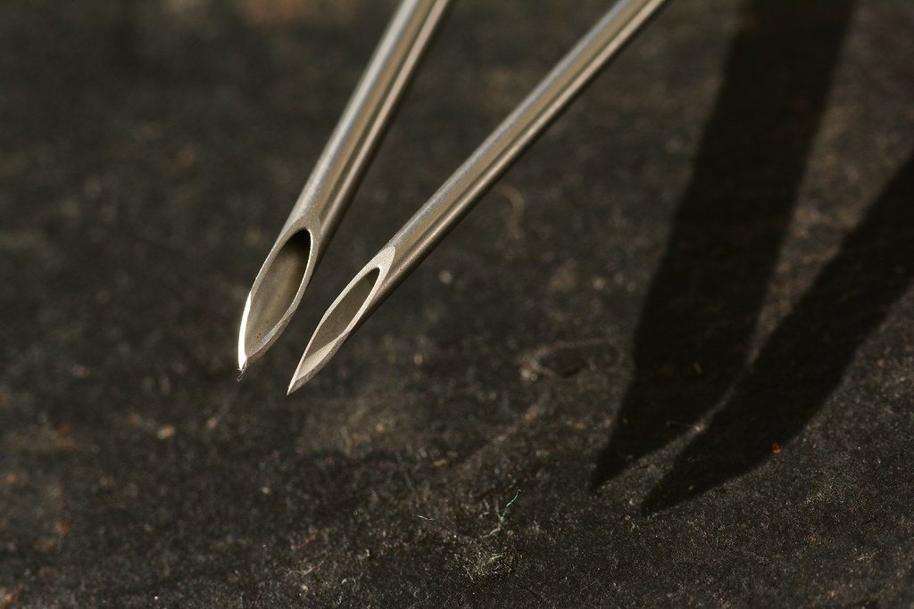 Two hypodermic needle tips close up